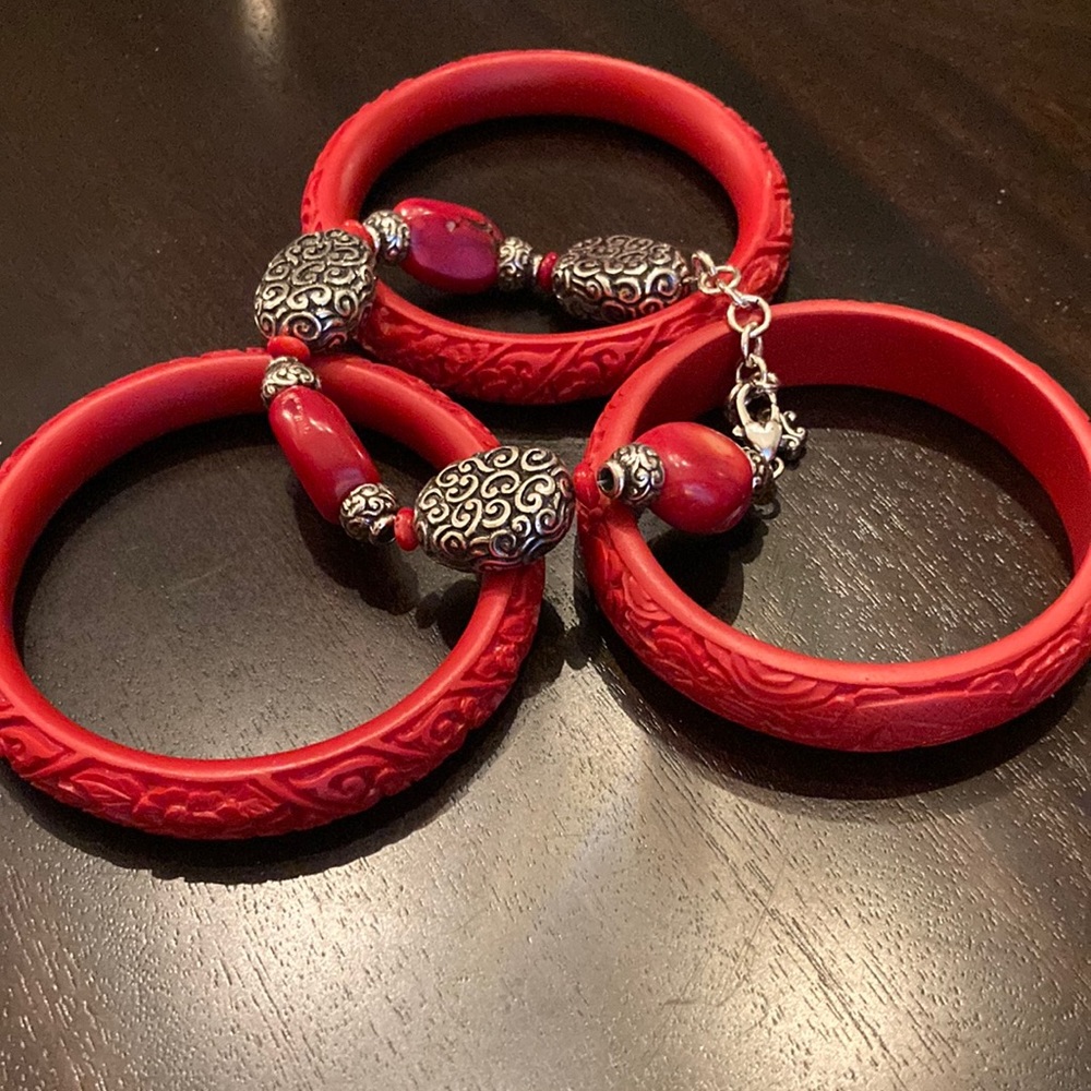 3 red bangles and 1 beaded bracelet